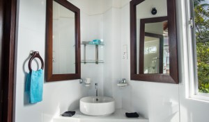 A picture of the top apartment's bathroom with a window.