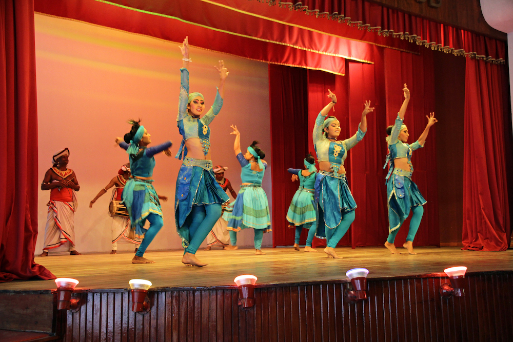 A picture of traditional dancers on stage in Kandy, Sri Lanka.