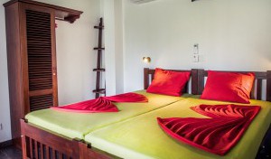 A close-up picture of beds and a wardrobe in a penthouse.