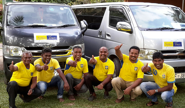 A picture of Sri Lankan drivers wearing Swedish national team shirts. They pose in front of minibuses with the Sophie Tours logo.